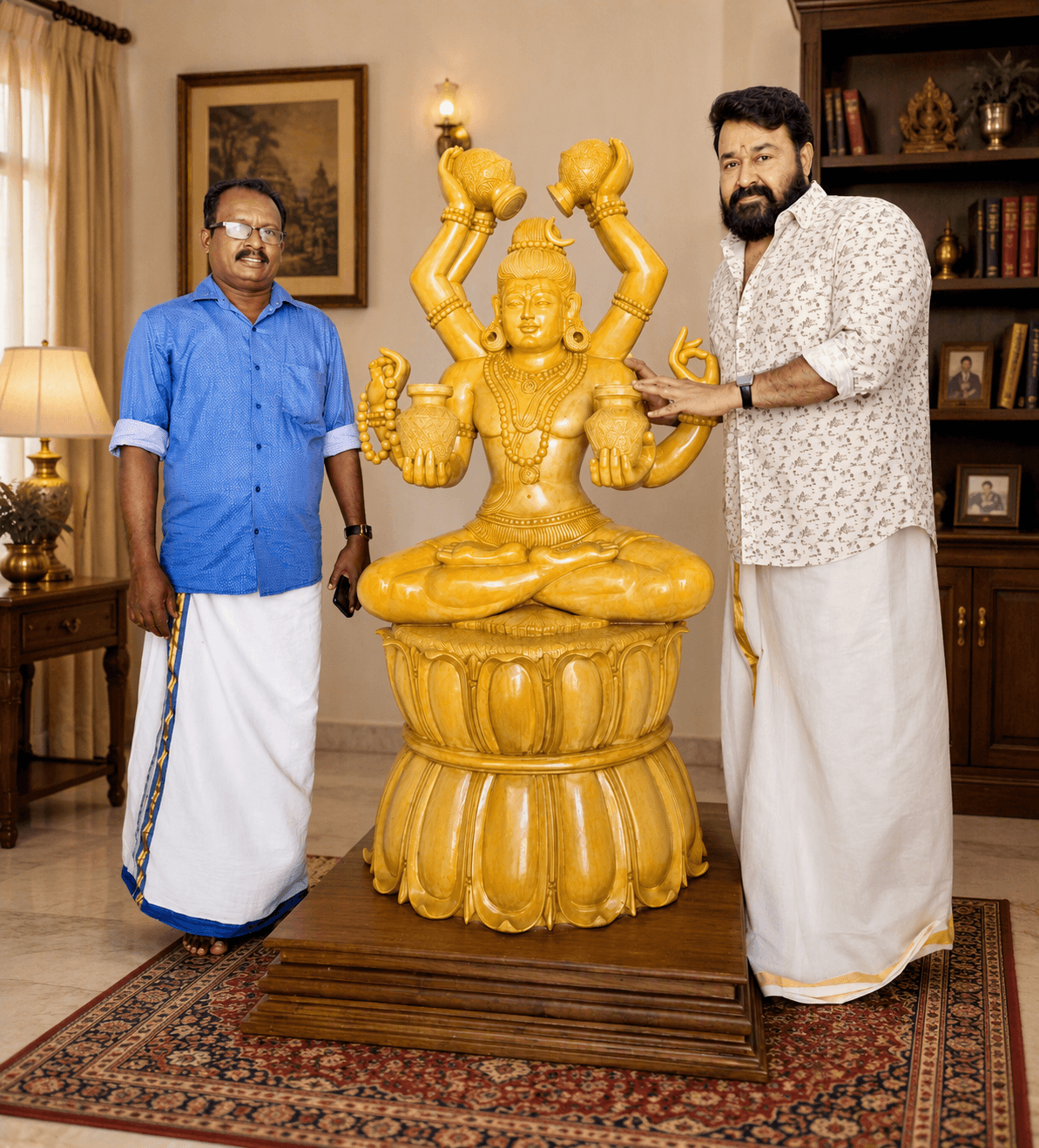 Master Artisan Shri Nagappan and Sri Mohanlal with the four-armed golden Lord Shiva sculpture