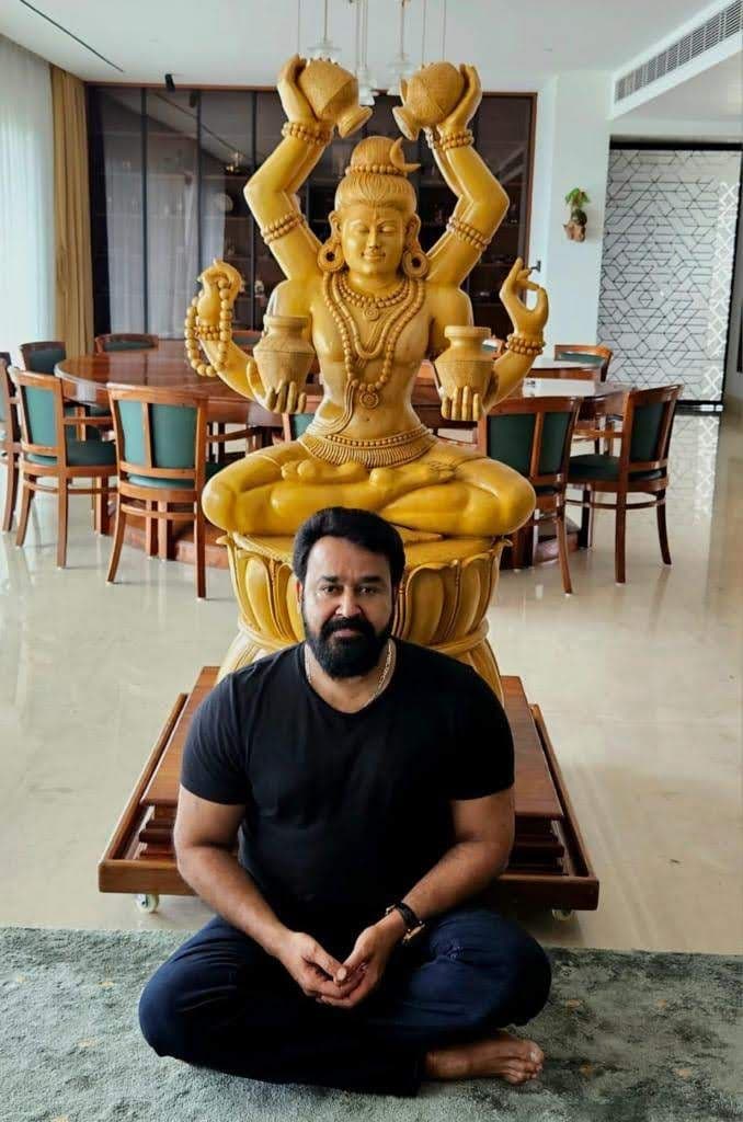 Superstar Sri Mohanlal seated in peaceful meditation in front of the sanctum Lord Shiva sculpture at his residence